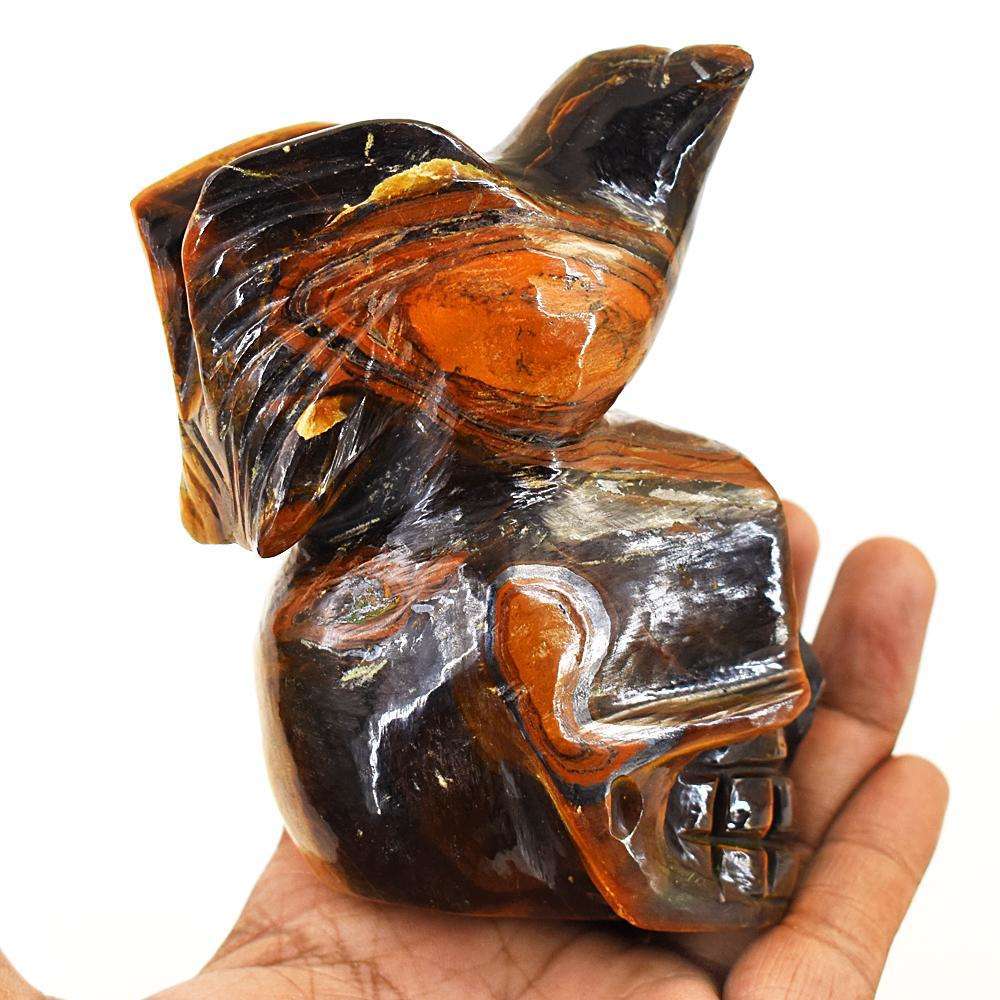 gemsmore:Artisian Tiger Eye Hand Carved Skull With Bird