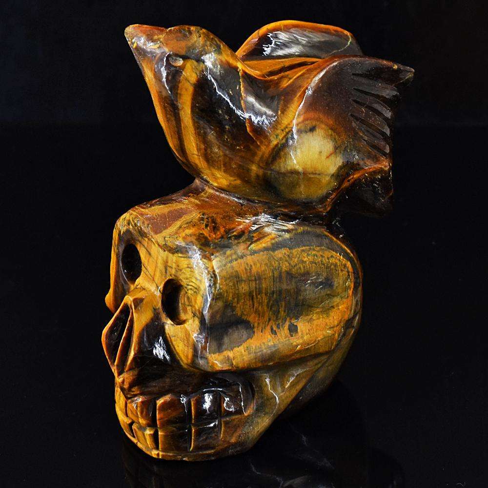 gemsmore:Artisian Tiger Eye Hand Carved Skull With Bird